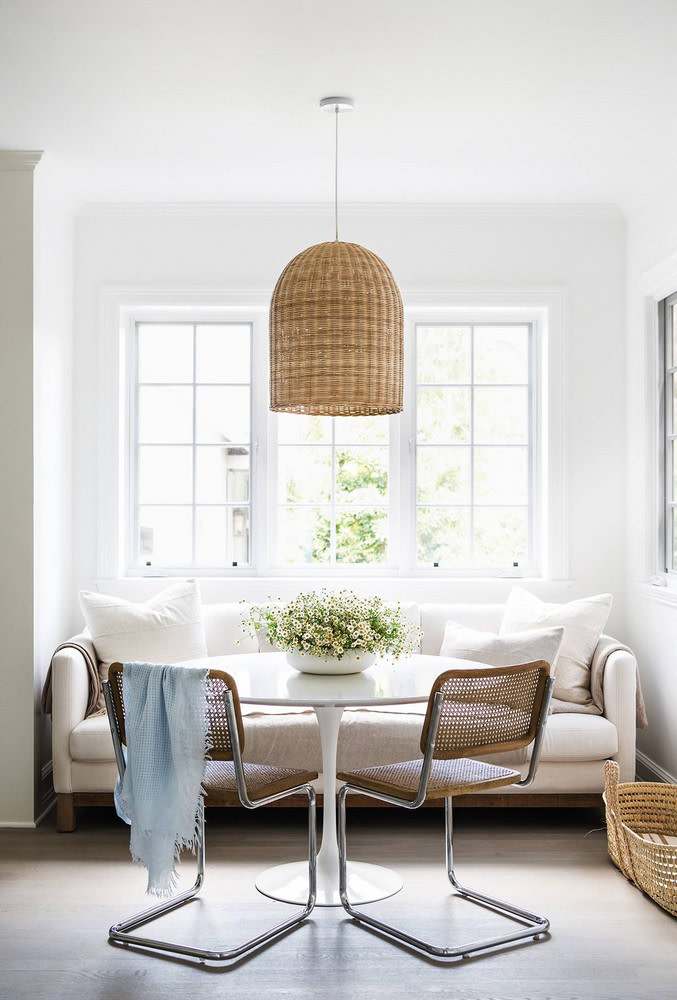 white pedestal table and settee